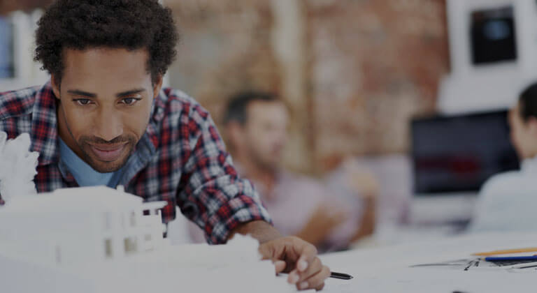 Man constructing model buildings